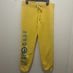 Aeropostle yellow sweatpants with blue peace patch